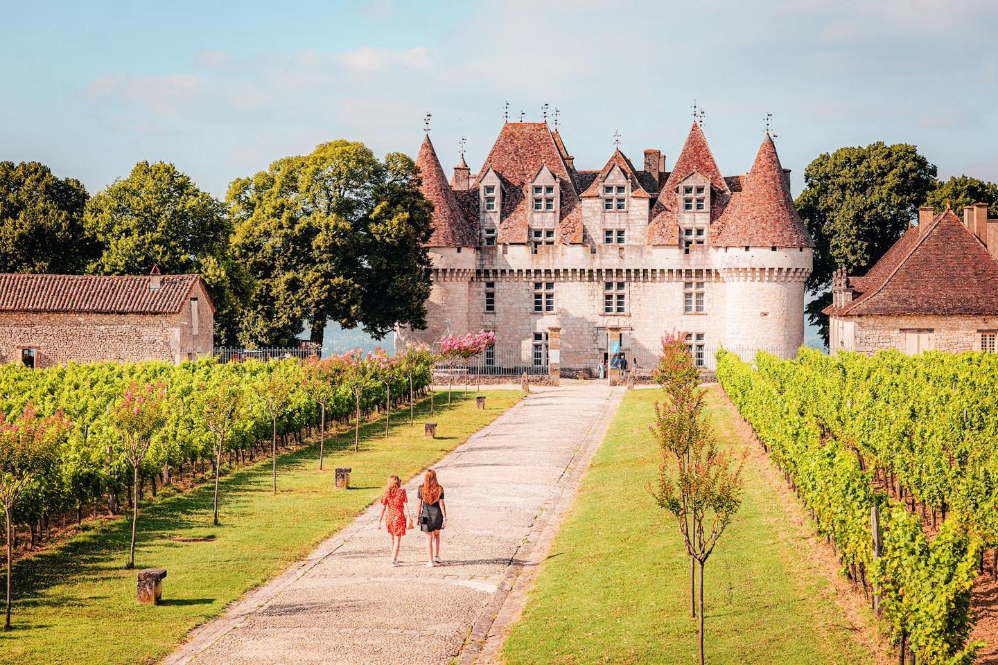 Château de Monbazillac framed by vineyard rows