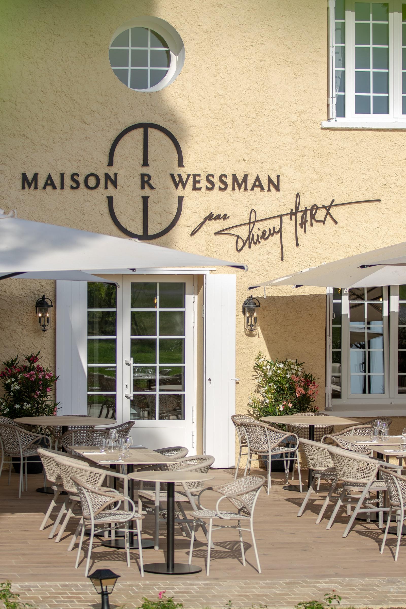 Dining tables on the Maison Wessman par Thierry Marx restaurant terrace
