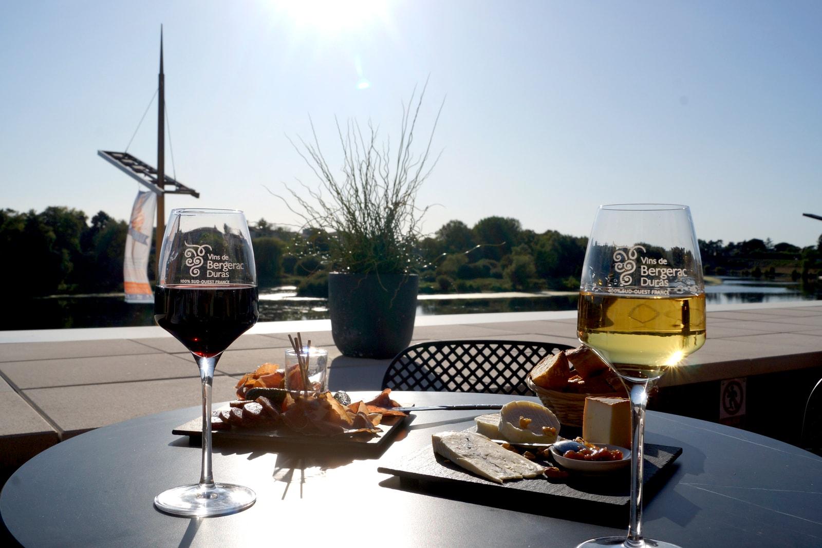 Wine and local food on Quai Cyrano’s terrace overlooking the Dordogne