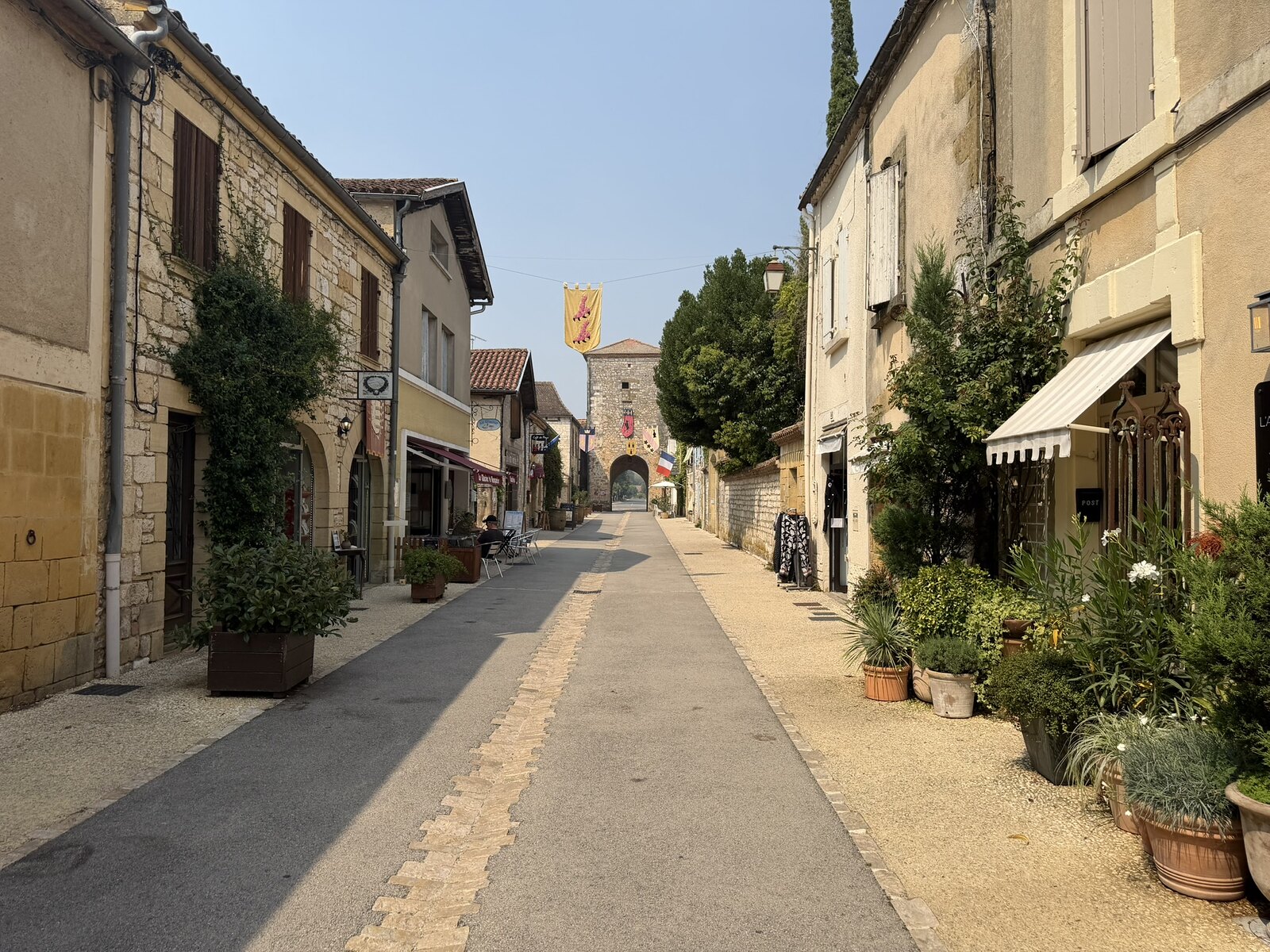 Rue Saint-Jacques in Monpazier showing the straight bastide street and closely aligned houses